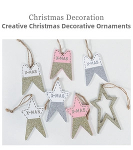 Detail view of pink and white X-MAS star ornaments with gold glitter and jute strings