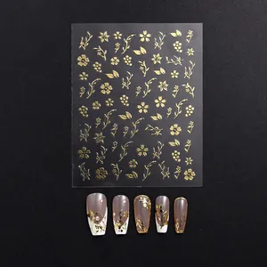 Golden cherry blossom nail art stickers with 3D floral decals and sample nail designs