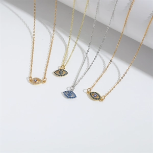 Minimalist Evil Eye pendant necklace in gold and silver finish with blue zircon stones