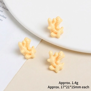 Detailed view of miniature resin ginger charms for DIY crafts and phone case decor
