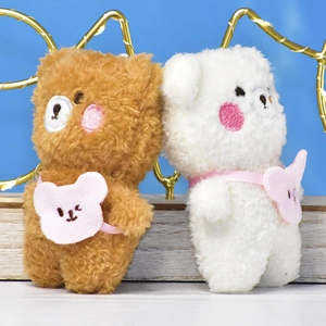 Pair of cute 4-inch plush bear keychains in brown and white with pink bibs.