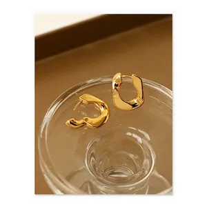 Polished 18K gold plated brass hoop earrings with organic wave design for women