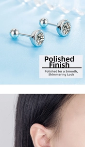 Detail of round zircon screw back stud earring showing polished finish and ear placement