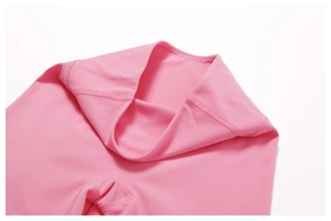 Detail view of reinforced stitching on pink high-waist yoga pants inner seam