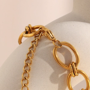 Close-up of chunky 18K gold plated stainless steel chain link necklace on a plaster bust