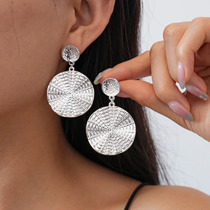 Silver geometric textured round drop earrings with woven pattern for a modern chic look