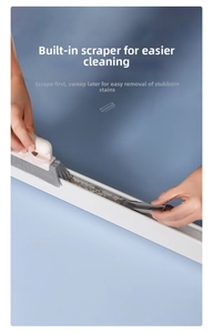 Close-up of a 2-in-1 window groove cleaning brush with scraper for tight corners