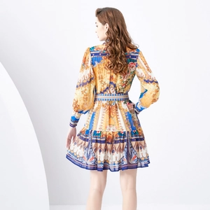 Back view of a retro baroque print mini dress with lantern sleeves and palace style details