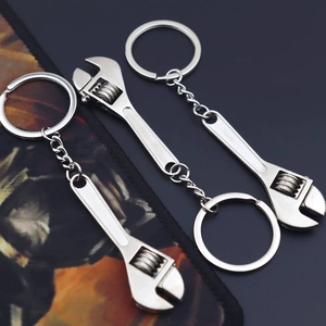 Three-piece set of silver zinc alloy mini adjustable wrench keychains with rotating worm gear