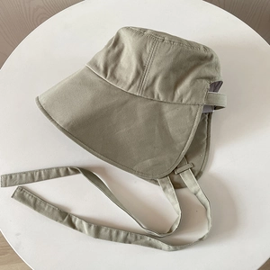 Detail of light khaki sun hat with wide neck flap and windproof drawstring straps