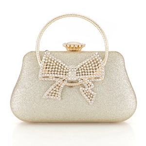 Elegant gold evening clutch bag with glitter finish and rhinestone bow handle