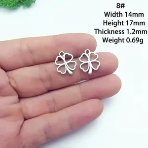 Detailed view of silver hollow clover charm showing 14x17mm dimensions and 0.69g weight