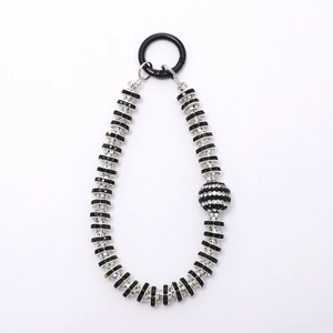 Luxurious beaded phone charm with black crystals and sparkling rhinestone inlaid spacers