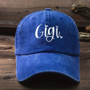 Close-up of Gigi embroidery on vintage washed blue cotton denim baseball cap detail