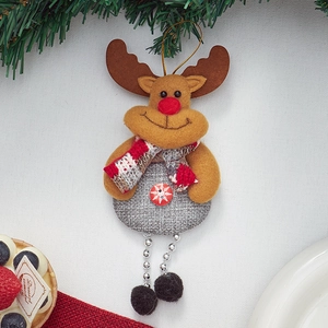 Detailed plush reindeer ornament with grey linen body and red scarf on Christmas tree