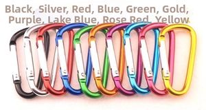 Flat lay of colorful D-shaped aluminum carabiners in ten various metallic finishes