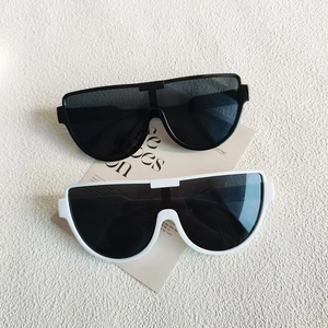 Fashionable oversized semi-rimless sunglasses in black and white colors for women