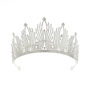 Detail view of Baroque silver crown with intricate rhinestone inlay and wave design