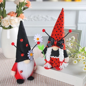 Pair of ladybug themed spring gnomes with daisy flowers for home desktop decoration