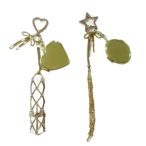 Golden keychain bag charms with pink bows, heart mirror, and metallic mesh crystals