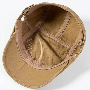 Detail of the quilted inner lining and adjustable side buckle of the retro flat cap