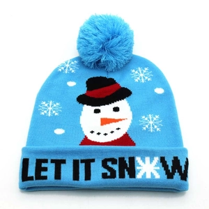 Close-up of light blue Christmas knit beanie featuring snowman and Let It Snow text