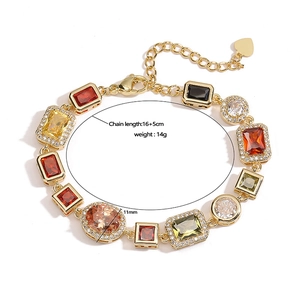 Vintage gold bracelet with colorful square gemstones and heart pendant detail