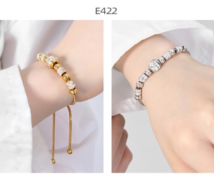 Detail view of gold and silver snake chain bracelets with sparkling crystal beads