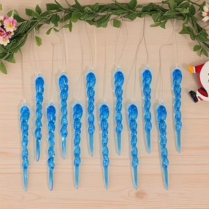 Detail of 12 blue spiral icicle ornaments hanging over a wooden background for Christmas