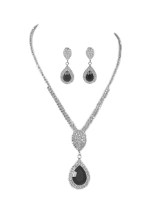 Detailed close-up of bridal jewelry set with silver rhinestones and black pear-shaped stones