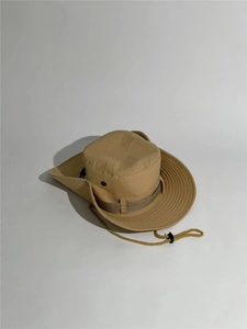 Detail view of khaki outdoor sun hat with windproof drawstring and metal air vents