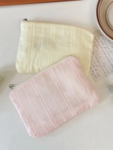 Elegant quilted lace cosmetic pouches in yellow and pink for stylish makeup organization