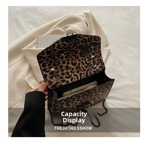 Interior view of leopard print crossbody bag showing spacious capacity for smartphones