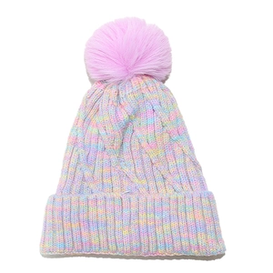 Rainbow gradient knit beanie with a pink faux fur pompom and cozy fleece lining