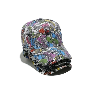 Three stacked graffiti baseball caps with colorful canvas shoe prints and curved brims