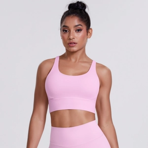 Front view of pink cross-back sports bra and high-waist leggings set for gym workouts