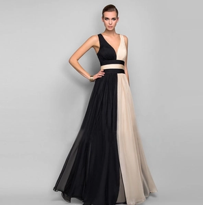Detail of elegant V-neck sleeveless floor-length gown in black and champagne color block
