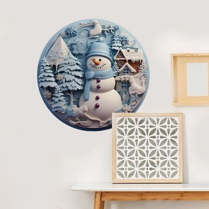 Detail of 3D snowman and pine tree wall sticker in a cozy modern living room setup