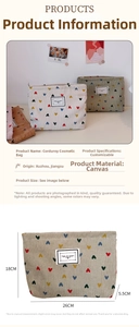 Detailed view of corduroy cosmetic bag with heart patterns and dimensions 26cm x 18cm