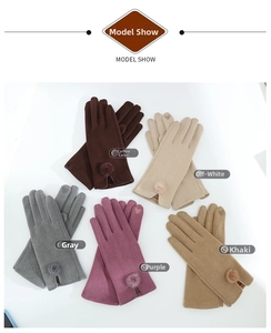 Close-up of winter warm gloves in five colors with cute pompom and heart embroidery