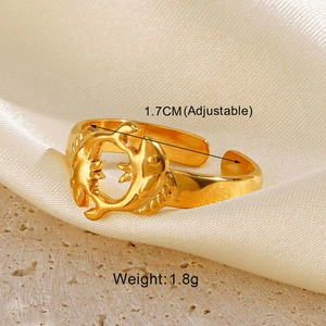 Detail of adjustable golden dolphin ring with size and weight specs on stone base