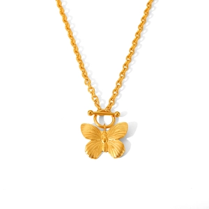 Golden butterfly necklace with OT toggle clasp on beaded steel chain against white background