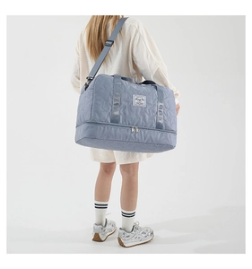 Model showing star-embossed travel bag with adjustable strap and waterproof fabric