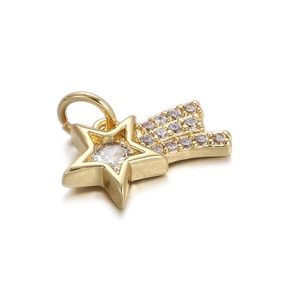 Macro shot of gold star-shaped pendant with sparkling clear gemstones on white backdrop