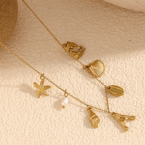 18K gold plated stainless steel necklace with ocean charms including shells and a star