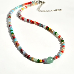 Detail of colorful beaded y2k necklace with green aventurine stone and lobster clasp