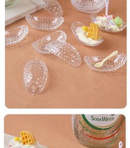 Macro detail of miniature embossed glass crescent bowls with tiny spoons for DIY crafts