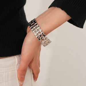 Detail of silver triple-layer hollow cuff bracelet with oval multi-row mesh design