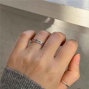 Detailed view of an antique S925 sterling silver double-layered twisted rope open ring