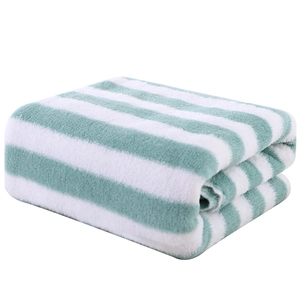 Absorbent green and white striped coral fleece towel set with soft plush texture